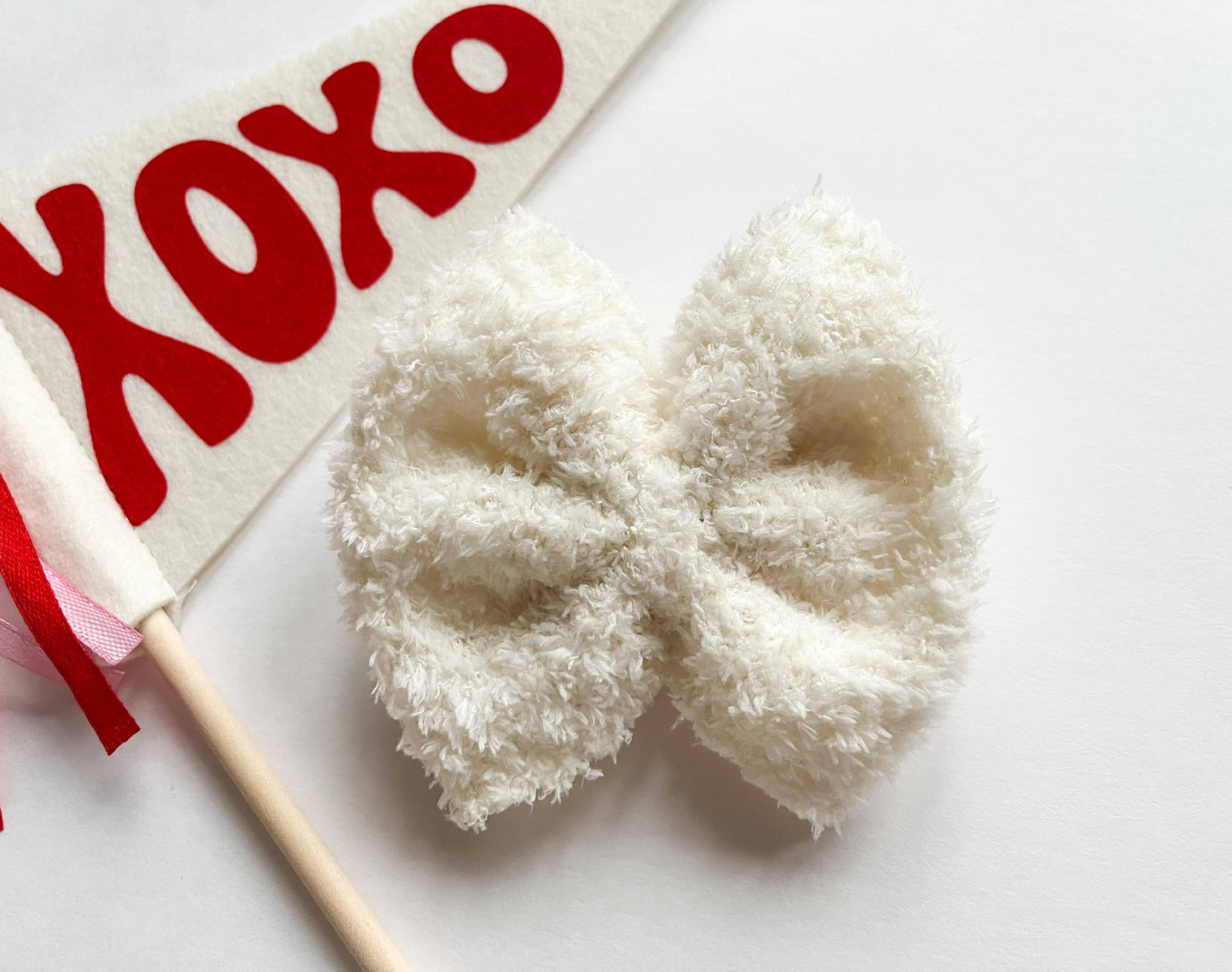 Fuzzy white bow for babies