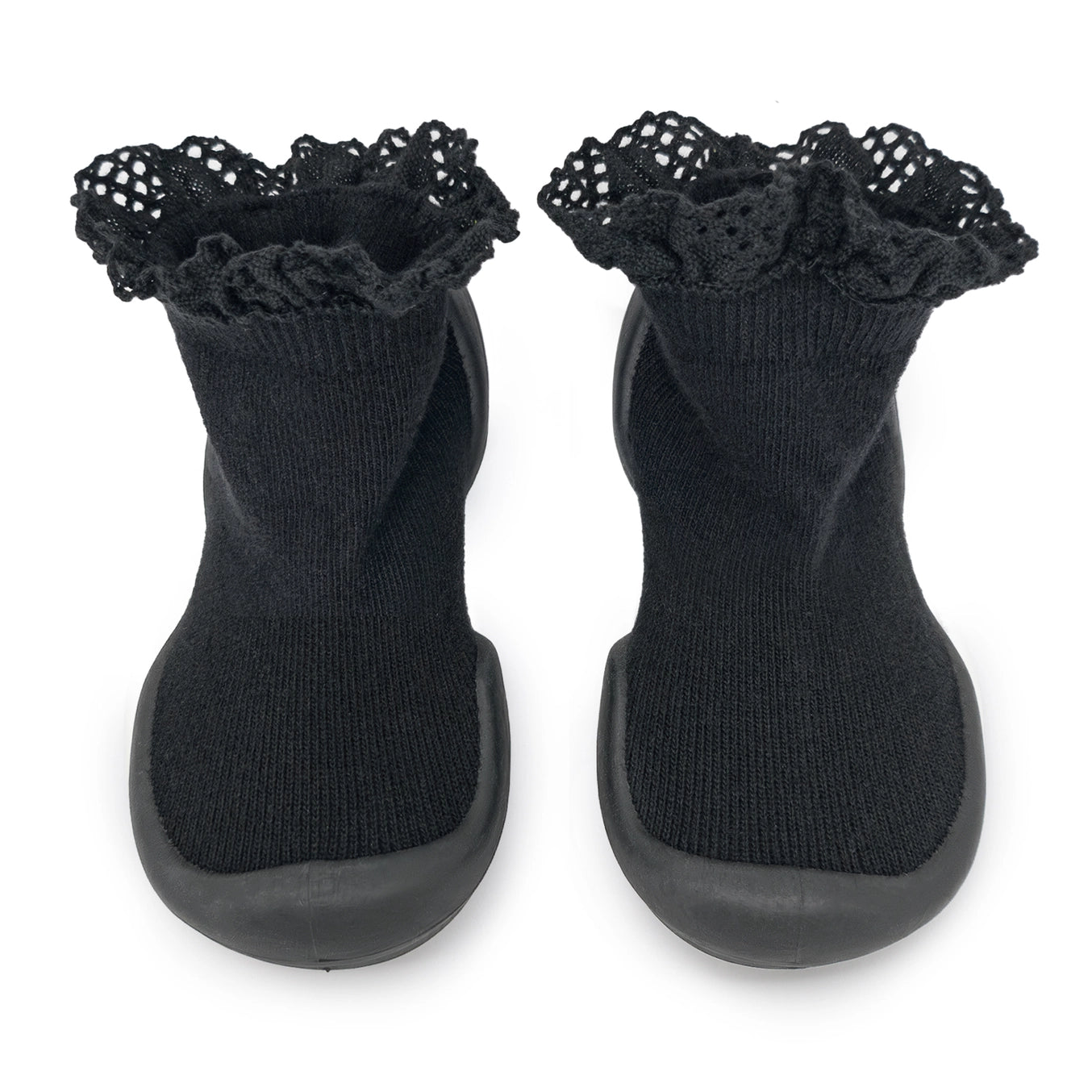 A pair of black Komuello First Walker Baby Sock Shoes with lace trim on the top and a non-slip rubber sole.