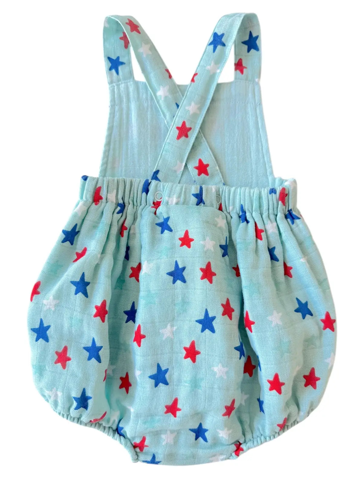 Light blue baby romper with red and blue star pattern on a white background