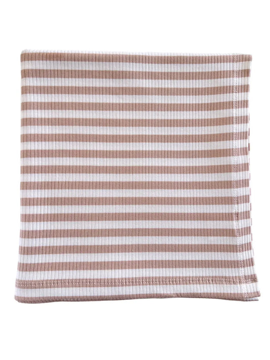 A beige and white striped organic ribbed swaddle blanket.